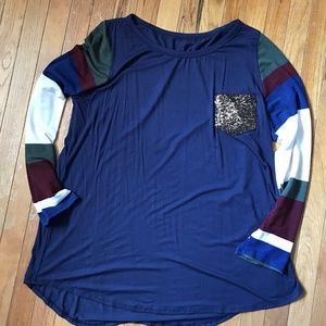 Navy blue top with striped sleeves and gold sequin